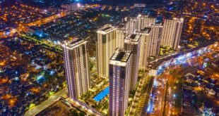 Foto tampilan modern perumahan Podomoro dengan taman hijau dan fasilitas lengkap di pusat kota
